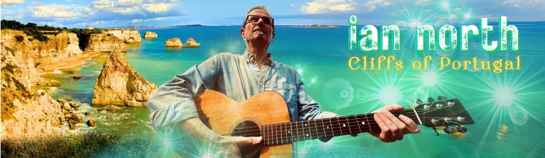 Ian North playing acoustic guitar in front of the Cliffs of Portugal